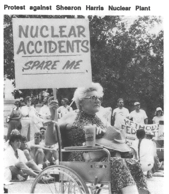 Protest against Shearon Harris nuclear plants, woman in wheelchair holding sign that reads Nuclear Accidents Spare Me