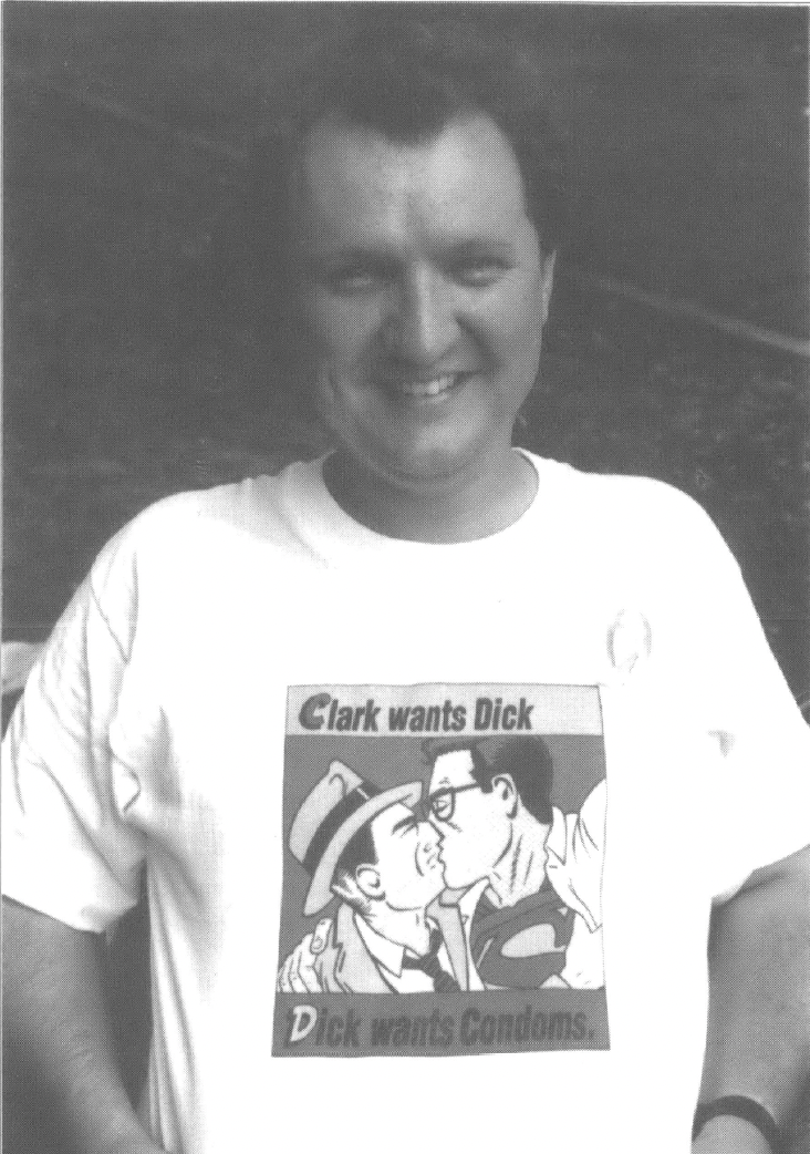 White man in t-shirt that reads "Clark wants Dick, Dick wants Condoms"