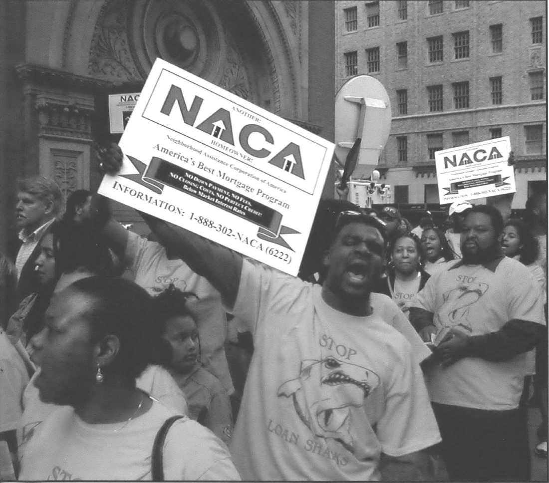 Protestors in street holding signs