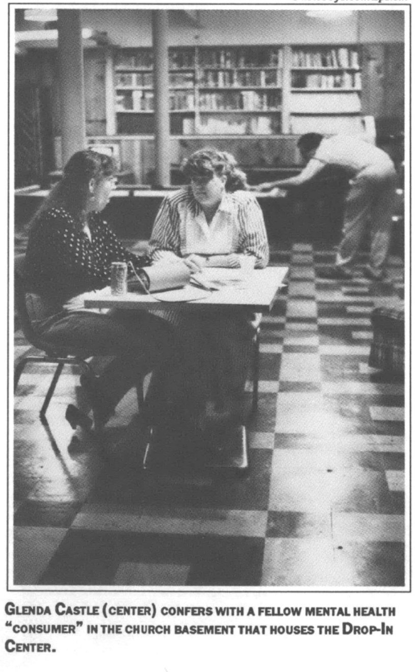 two women sitting and talking