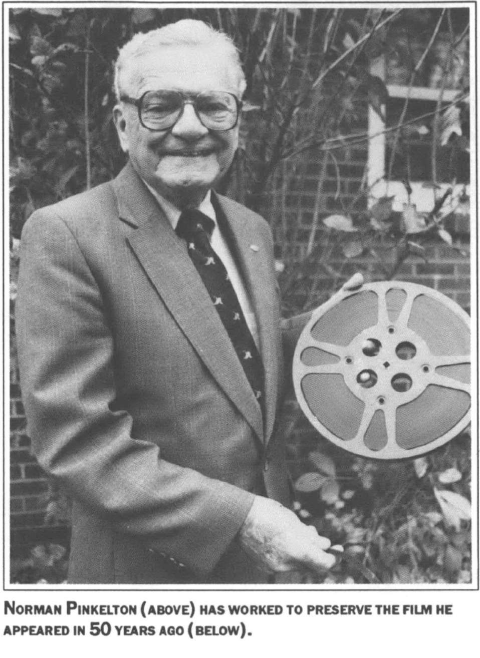 Norman Pinkelton holding a film reel