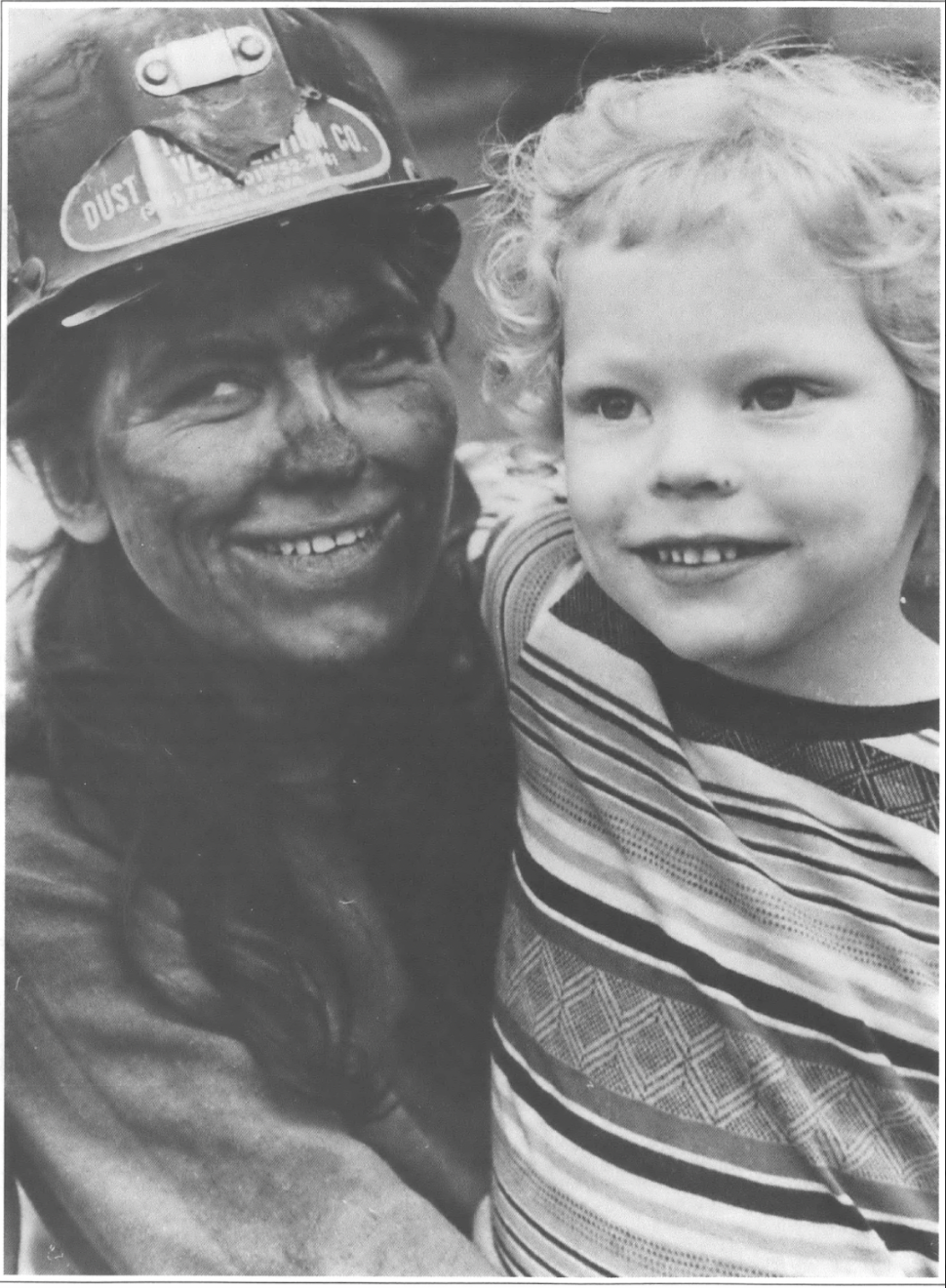 coal miner and child smiling