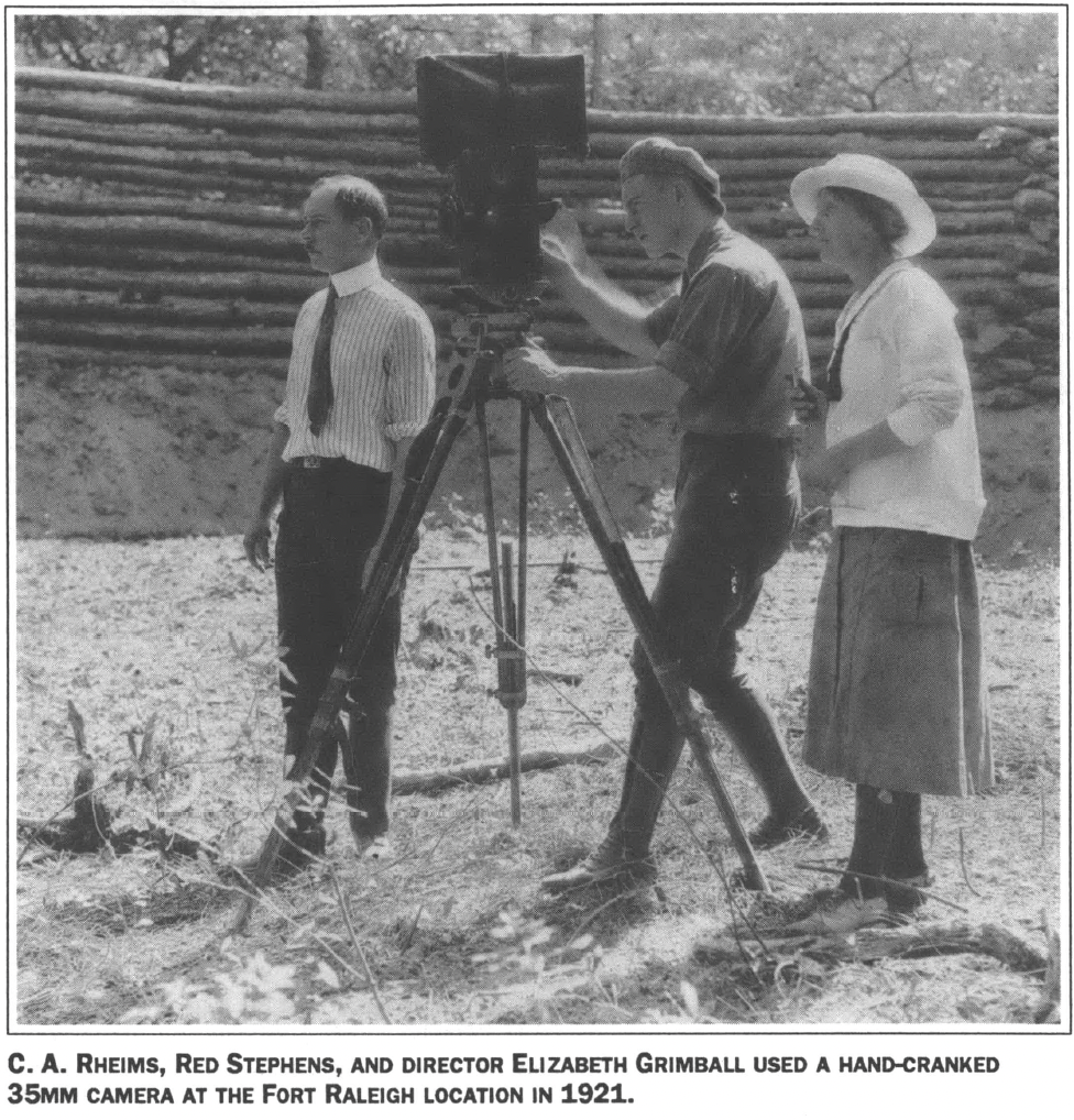 Three people filming a movie 