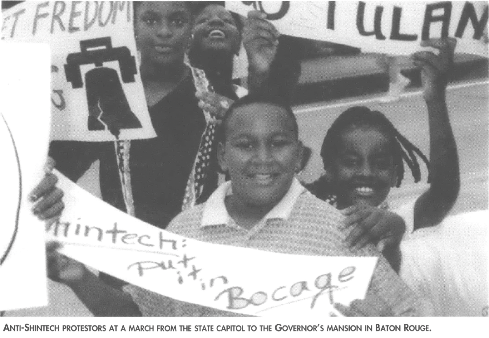 Children holding protest signs